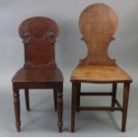 A Victorian mahogany hall chair with carved scrolls & fluted pilasters to the rounded back, on