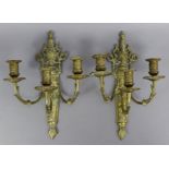 A pair of 19th century brass three-branch wall sconces with pierced foliate decoration; 9” wide x