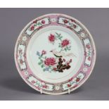 Two 18th century Chinese porcelain plates, each decorated in famille rose enamels with a bird on