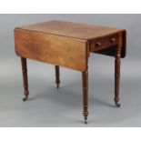 A Victorian mahogany pembroke table with rounded corners to the drop leaves, fitted oak-lined drawer