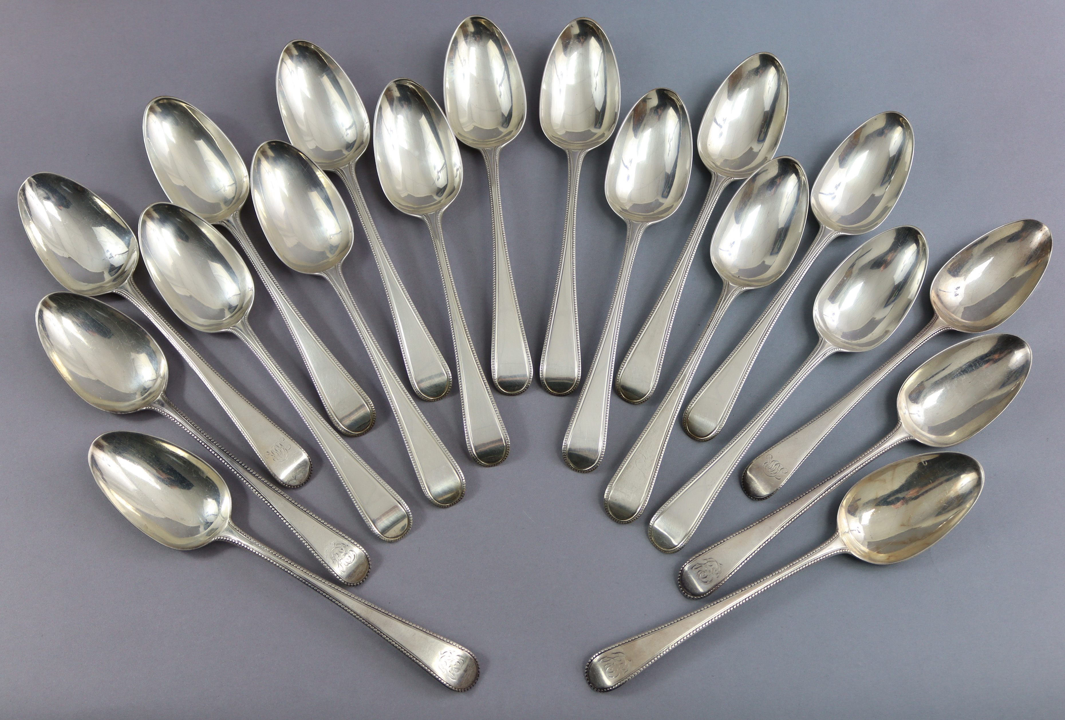 Eighteen George III silver Old English Bead pattern table spoons, by George Smith III; fourteen