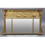 A Regency giltwood triple-panel overmantel mirror with classical figure scene gesso decoration to