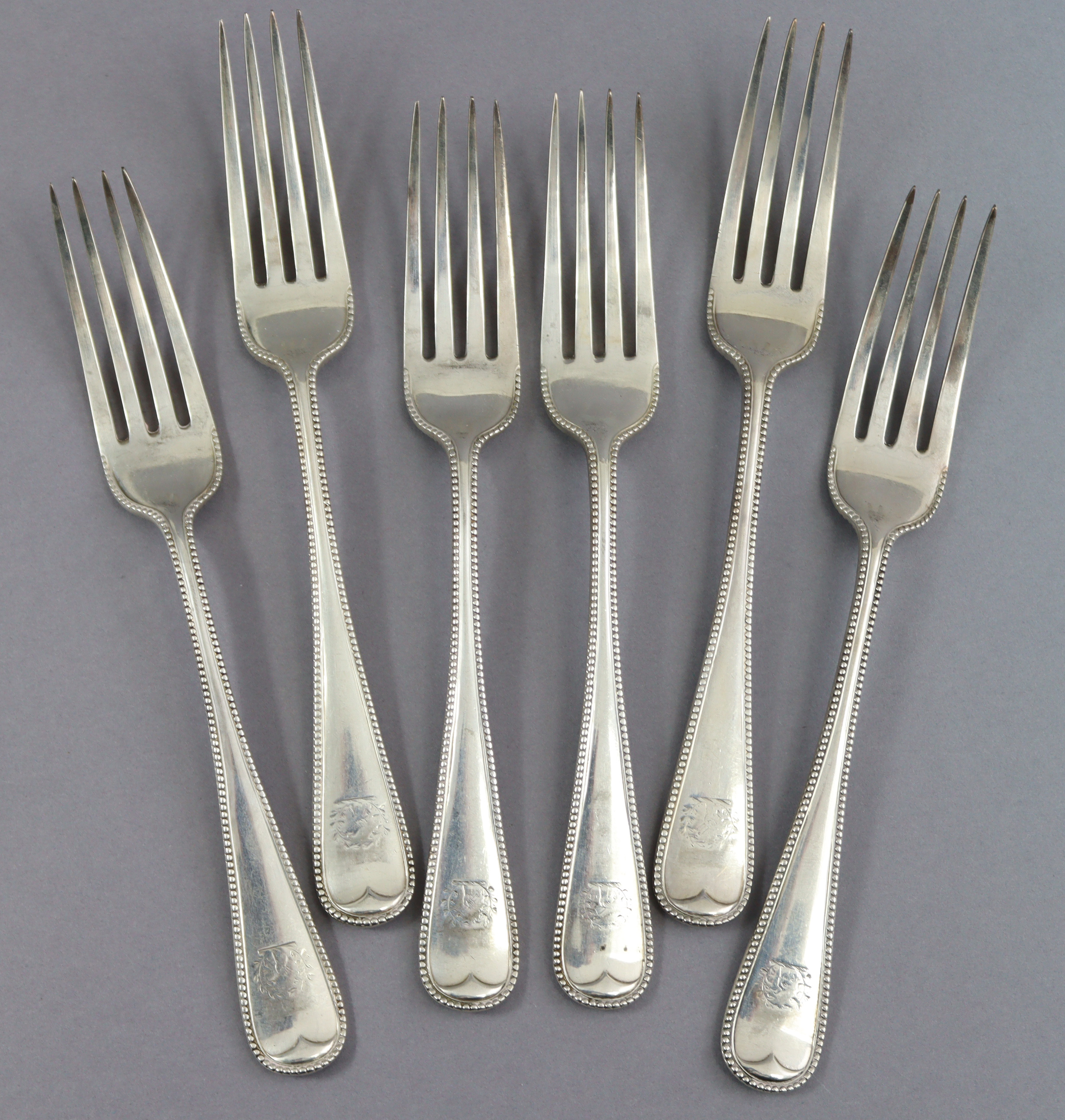 Six Victorian silver Old English Bead pattern table forks; four London 1860, two 1862, all by