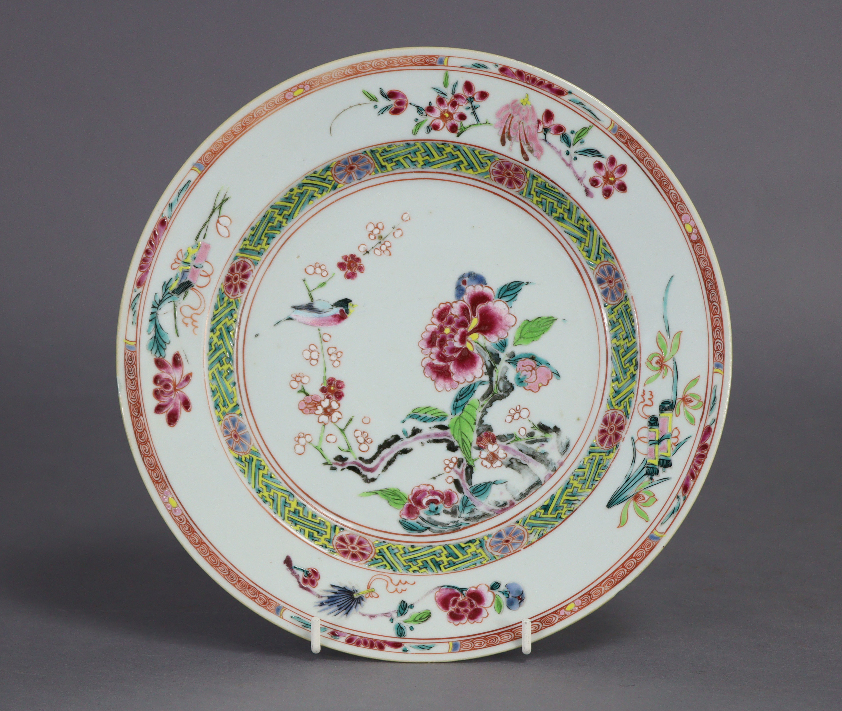 Two 18th century Chinese porcelain plates, each decorated in famille rose enamels with a bird on - Image 2 of 4