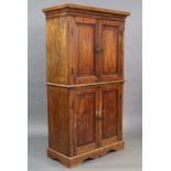 An early 19th century French provincial chestnut hall cupboard, with moulded cornice above two pairs