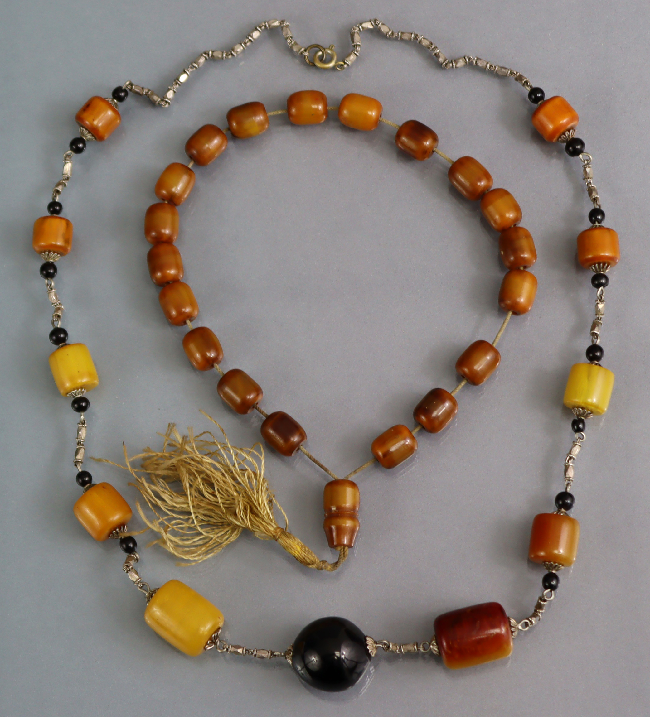 Two amber bead necklaces.