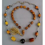 Two amber bead necklaces.