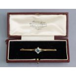 A 9ct. gold bar brooch set square-cut aquamarine approximately 1.2 carats; 2¼” long.