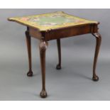 A George II style walnut card table with crossbanded fold-over top and protruding, rounded corners
