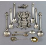 Five Georg Jensen .835 standard coffee spoons with stylised floral terminals, circa 1915-30; a Georg