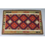 A Maimana kelim rug of ochre ground with repeating lozenge design within narrow geometric border,