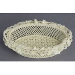 A Belleek porcelain three-stand oval two-handled dish with flower & foliage to the rim, 7½” wide (