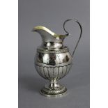 A mid-19th century Swedish silver jug with round semi-fluted body, gilt interior, loop handle, &