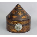 An early/mid 20th century Chinese black & gold lacquered hat box decorated with dragons chasing