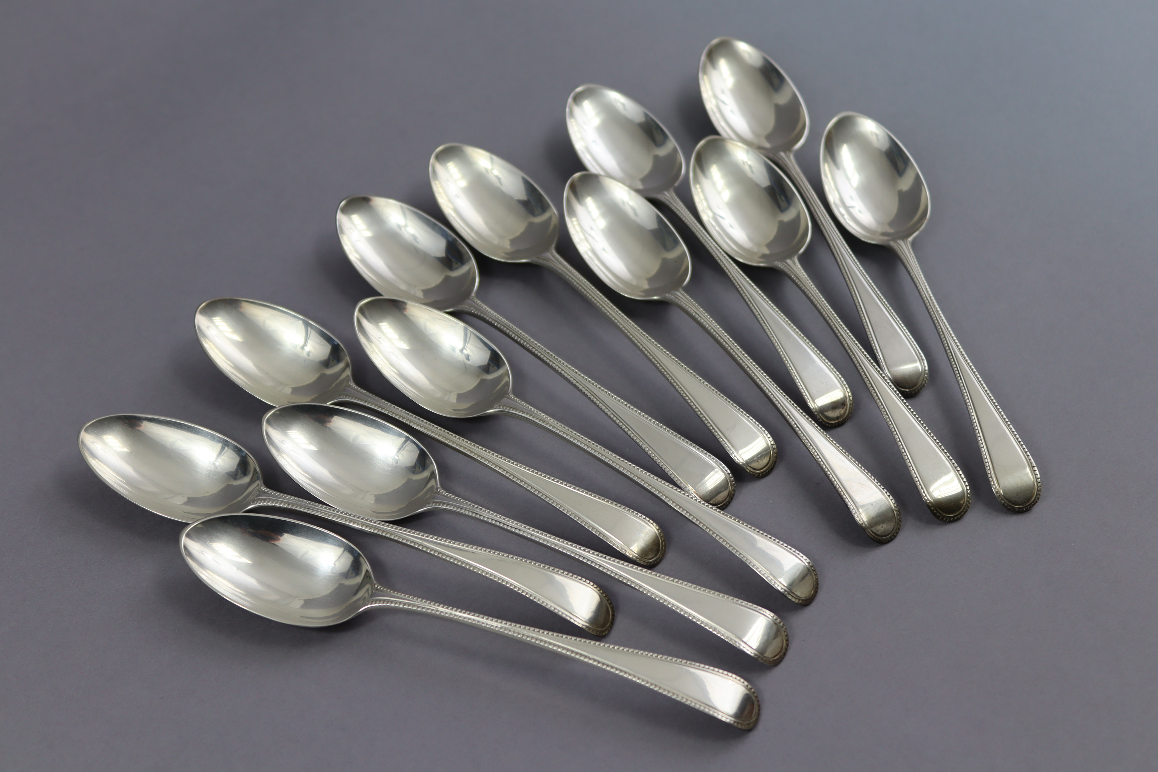 Twelve George III silver Old English Bead pattern dessert spoons by George Smith III; London 1778 ( - Image 2 of 3