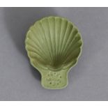 A RARE WEDGWOOD GREEN JASPER CADDY SPOON, moulded in the form of a scallop shell, with impressed