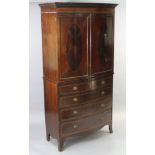 A George III style inlaid mahogany bow-front linen press, the upper part fitted three sliding