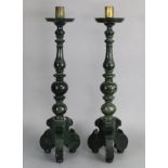 A pair of dark green soapstone altar candlesticks, the colouration resembling spinach-green jade,