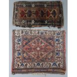 A small Persian mat of ivory ground with central lozenge within a stylised border, 27” x 31”;