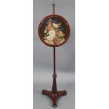 A Victorian mahogany pole banner screen with circular needlework panel, initials “H M” to