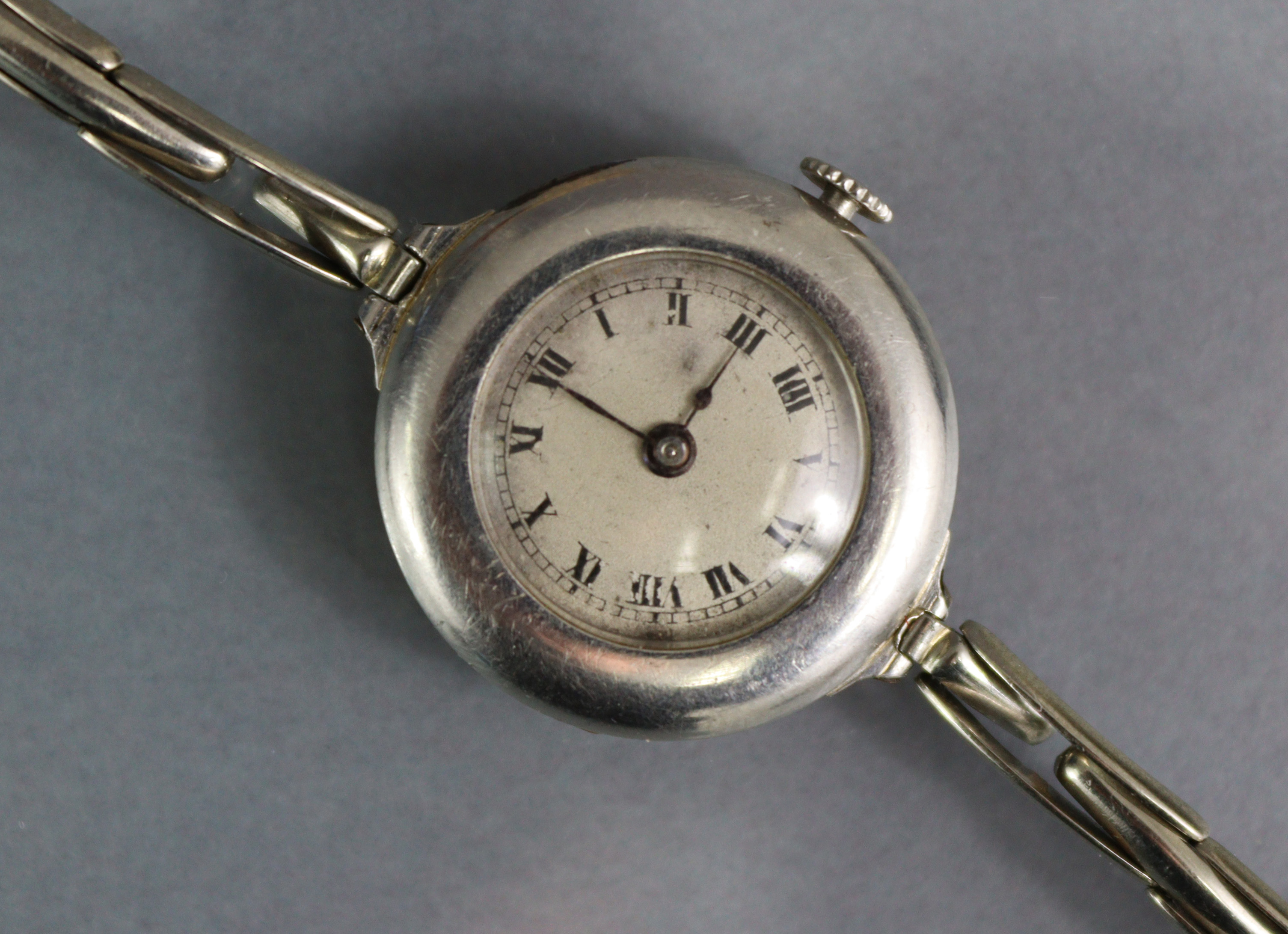 An early 20th century ladies’ wristwatch, the small silvered circular dial with black roman