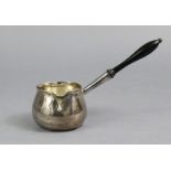 A George I silver brandy saucepan of baluster shape, with ebonised turned wood handle, 6¾” long;