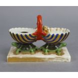 A 19th century Paris porcelain inkstand in the form of two halves of an open clam shell with central