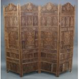 An eastern inlaid hardwood four-fold draught screen with pierced foliate decoration, inlaid with