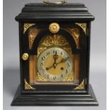 A late 19th/early 20th century bracket clock with brass & silvered arch dial & applied gilt