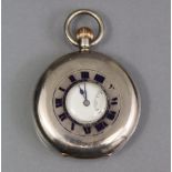 An early 20th century silver half-hunter pocket watch with blue enamel exterior chapter ring,