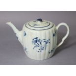An 18th century Worcester porcelain reeded barrel-shaped teapot, painted in blue with the “