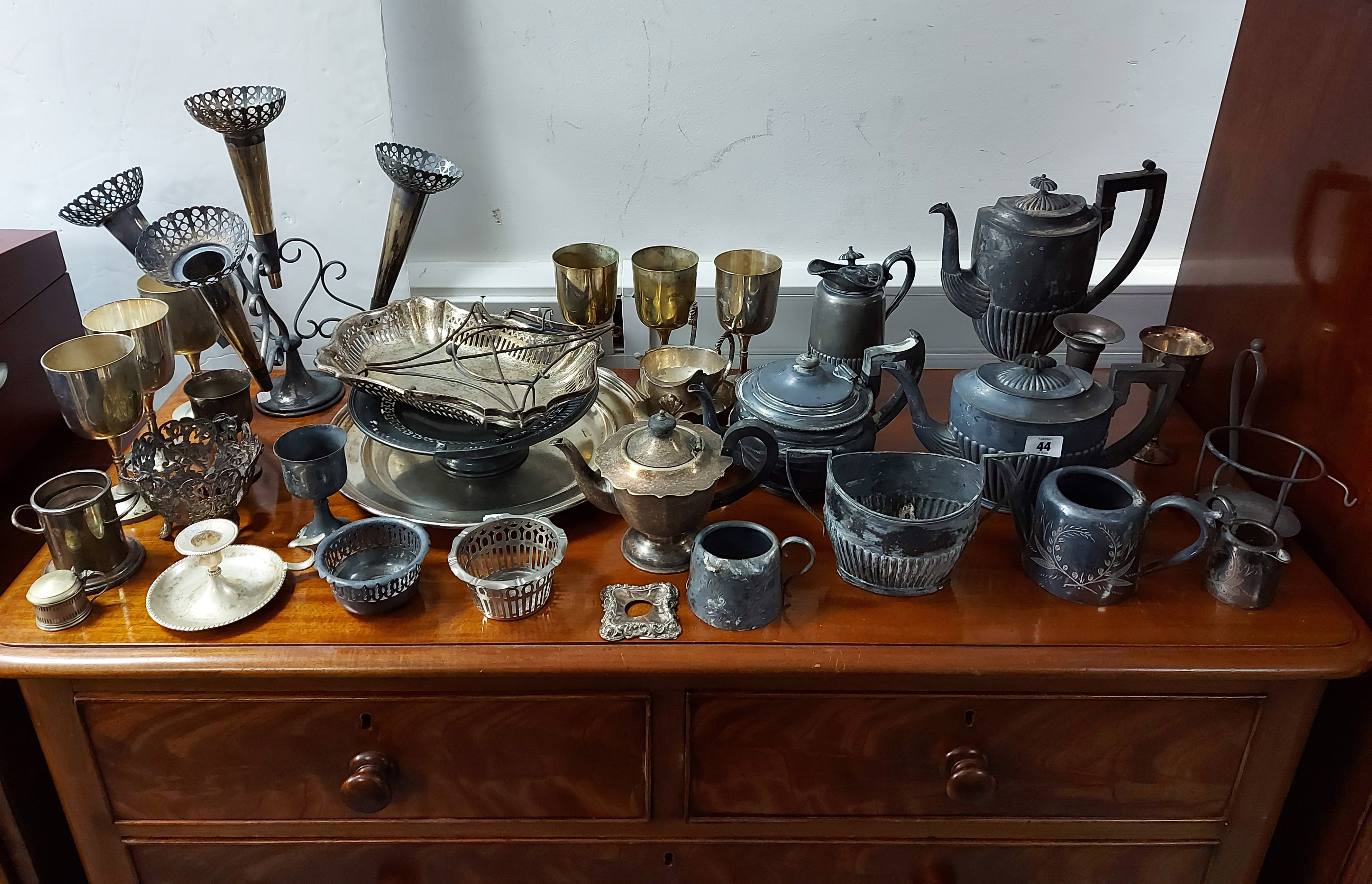 A silver-plated four-piece tea & coffee service of oval semi-fluted design; a silver-plated table