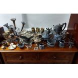 A silver-plated four-piece tea & coffee service of oval semi-fluted design; a silver-plated table