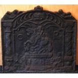 A 17th century style cast-iron fire-back with relief decoration & inscribed with initials “C. R.”