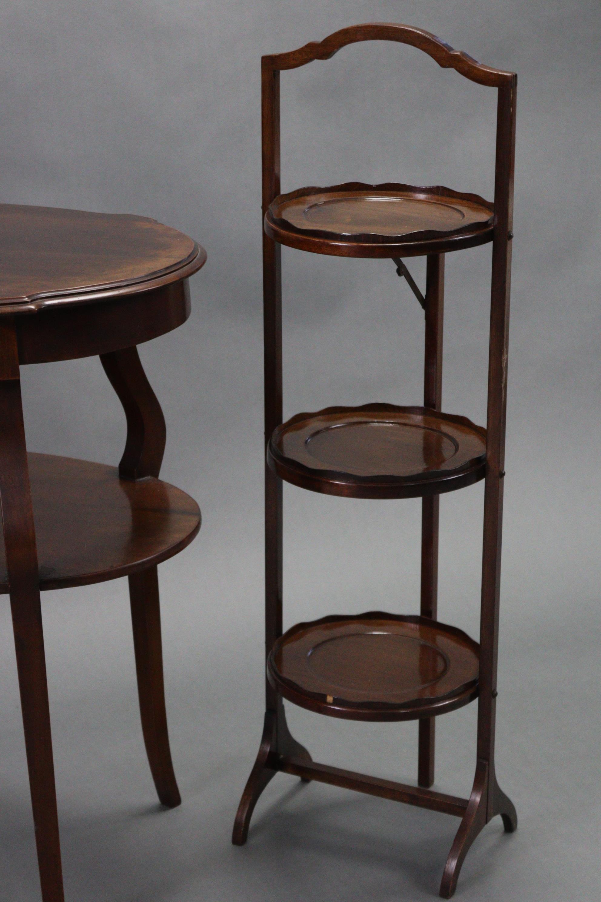 An Edwardian mahogany oval occasional table on four cabriole legs with open undertier, 27” wide; - Image 4 of 6