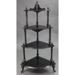 A Victorian ebonised & carved wooden corner whatnot of four open tiers, with turned & fluted