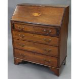 An Edwardian inlaid-mahogany small bureau, with fitted interior enclosed by fall-front above four