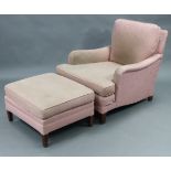 A square back easy chair upholstered pink floral material, & on short square tapered legs; & a ditto