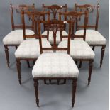 A set of six Victorian carved mahogany splat-back dining chairs with padded seats, & on square