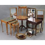 A reproduction mahogany nest of three rectangular occasional tables; together with three other