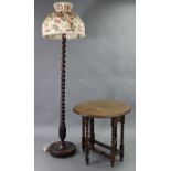 A 1930’s oak standard lamp with barley-twist & carved centre column & on round base with ball