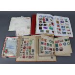 A small collection of mostly foreign stamps, covers, etc., in small albums & loose.