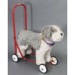 A 1970’s ‘dog’ baby-walker, 15” high.