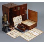 AN EARLY 20th century CARL ZEISS JENA BLACK LACQUERED MONOCULAR MICROSCOPE WITH BRASS FITTINGS (