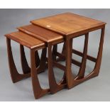 A Dunelm nest of three teak rectangular occasional tables.