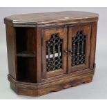 A hardwood low cabinet with centre shelf enclosed by pair of iron grille doors flanked by open