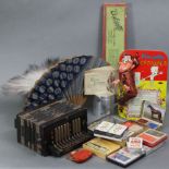 A mid-20th century ebonised wooden child’s piano accordion, 10¼” wide; together with two fans;