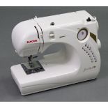 A Janome “Gem Gold 2” electric sewing machine, w.o., boxed.
