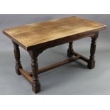A GOOD QUALITY REPRODUCTION OAK DRAW-LEAF DINING TABLE on four turned legs with plain stretchers,