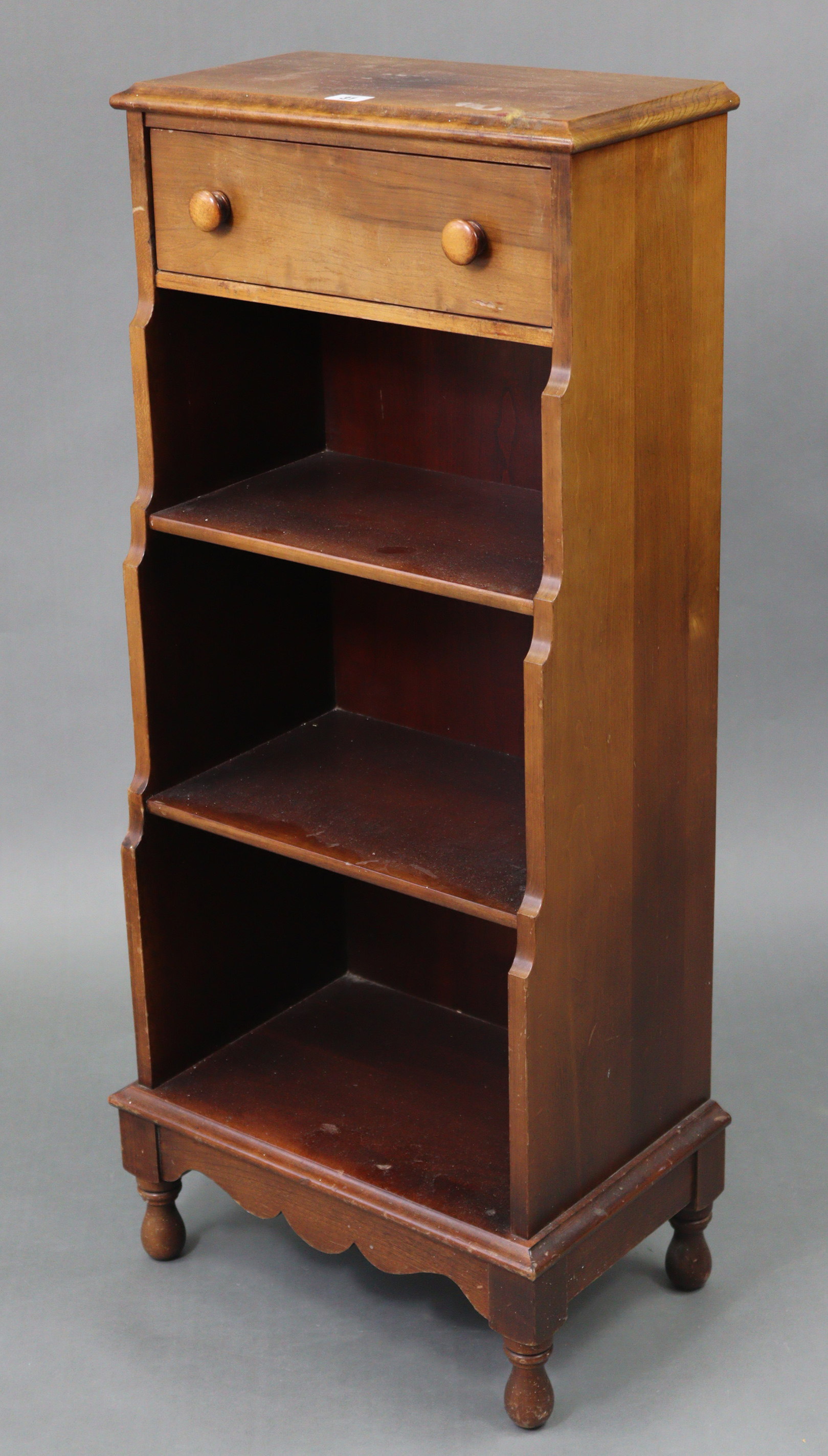 A mahogany small waterfall bookcase by CARL FORSLUND, MICHIGAN, USA, fitted frieze drawer above